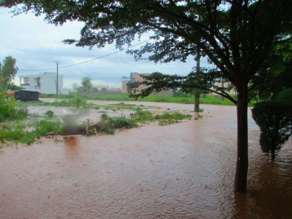The river/road in front of our house during rainy season.